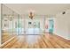 Spacious living room with hardwood floors and mirrored walls at 1300 N Portofino Dr # 208, Sarasota, FL 34242