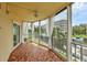 Spacious lanai with water views and tiled floor at 1300 N Portofino Dr # 208, Sarasota, FL 34242