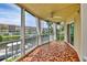 Spacious screened balcony overlooking waterfront with tile flooring at 1300 N Portofino Dr # 208, Sarasota, FL 34242