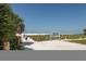 Beach access path with Siesta Beach signage at 1300 N Portofino Dr # 208, Sarasota, FL 34242