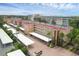 Aerial view of a condo building with parking and landscaping at 1300 N Portofino Dr # 208, Sarasota, FL 34242