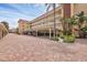Condo building exterior showcasing parking and landscaping at 1300 N Portofino Dr # 208, Sarasota, FL 34242