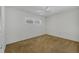Well-lit bedroom with carpet and ceiling fan at 1300 N Portofino Dr # 208, Sarasota, FL 34242