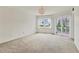Spacious bedroom with carpet flooring and water views at 1300 N Portofino Dr # 208, Sarasota, FL 34242