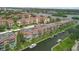 Aerial view of community showing buildings and waterfront location at 1300 N Portofino Dr # 208, Sarasota, FL 34242