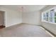 Bright bedroom with carpet flooring and water views at 1300 N Portofino Dr # 208, Sarasota, FL 34242