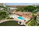 Aerial view of community pool, spa, and lounge area at 1300 N Portofino Dr # 208, Sarasota, FL 34242