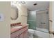 Bathroom with granite vanity and a bathtub at 1300 N Portofino Dr # 208, Sarasota, FL 34242