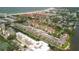 Expansive aerial view of community, beach, and surrounding area at 1300 N Portofino Dr # 208, Sarasota, FL 34242