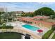 Community pool and spa with lounge chairs and waterfront access at 1300 N Portofino Dr # 208, Sarasota, FL 34242