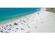 Beach with turquoise water and many people relaxing at 1300 N Portofino Dr # 208, Sarasota, FL 34242