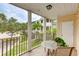 Screened balcony with a table and chairs, overlooking a courtyard at 4802 51St W St # 1305, Bradenton, FL 34210
