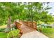 Wooden footbridge crossing a tranquil waterway at 4802 51St W St # 1305, Bradenton, FL 34210