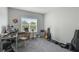 Bright bedroom with large window, workspace, and carpeted floors at 4802 51St W St # 1305, Bradenton, FL 34210