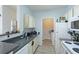 Well-equipped kitchen with gray countertops, white appliances, and ample cabinet space at 4802 51St W St # 1305, Bradenton, FL 34210