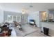 Bright living room with hardwood floors, comfy sofa, and large TV at 4802 51St W St # 1305, Bradenton, FL 34210