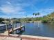 Private wooden dock with boat access in a tranquil canal setting at 500 Buttonwood Dr, Longboat Key, FL 34228