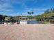Brick paved boat dock with two covered boat slips at 500 Buttonwood Dr, Longboat Key, FL 34228