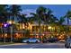 Night view of shops and restaurants in a vibrant area at 500 Buttonwood Dr, Longboat Key, FL 34228