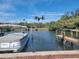 Private boat dock with covered boat slip and access to the water at 500 Buttonwood Dr, Longboat Key, FL 34228