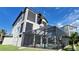 Modern home with a large screened-in pool and lanai area at 500 Buttonwood Dr, Longboat Key, FL 34228