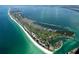 Aerial view of Longboat Key featuring beach, golf course, and residential areas at 500 Buttonwood Dr, Longboat Key, FL 34228