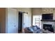 Living room features a fireplace, comfortable seating, and a sliding barn door at 500 Buttonwood Dr, Longboat Key, FL 34228