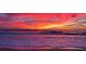 Stunning oceanfront view with a vibrant sunset sky at 500 Buttonwood Dr, Longboat Key, FL 34228