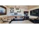 Cozy Gathering room with sectional sofa, large TV, and a beverage station at 500 Buttonwood Dr, Longboat Key, FL 34228