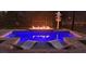 Relaxing pool area with fire pit and comfortable lounge chairs at 500 Buttonwood Dr, Longboat Key, FL 34228