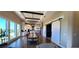 Bright dining room with a large farmhouse table and stunning natural light at 500 Buttonwood Dr, Longboat Key, FL 34228