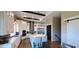 Modern kitchen with white cabinets, quartz countertops, and stainless steel appliances at 500 Buttonwood Dr, Longboat Key, FL 34228