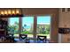 Dining area boasts gorgeous ocean views from expansive windows at 500 Buttonwood Dr, Longboat Key, FL 34228