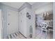 White kitchen with pantry and view into the dining area at 1440 Georgetowne Dr, Sarasota, FL 34232