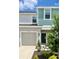 Two-story home with light gray and teal siding at 3055 Novara Ln, Lakewood Ranch, FL 34211