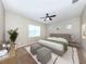 Serene bedroom features a plush bed, soft lighting, and neutral tones for a relaxing ambiance at 11406 Belvedere Ter, Lakewood Ranch, FL 34211