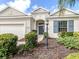 Inviting front entrance showcases a well-maintained home with manicured landscaping and a charming walkway at 11406 Belvedere Ter, Lakewood Ranch, FL 34211