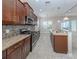 Modern kitchen boasts granite countertops, stainless steel appliances, and ample cabinet space for storage at 11406 Belvedere Ter, Lakewood Ranch, FL 34211