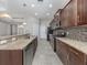 Updated kitchen with granite countertops, stainless steel appliances, and dark wood cabinets at 11406 Belvedere Ter, Lakewood Ranch, FL 34211