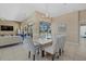 Open concept dining room with views of the lanai and pool at 974 Rotonda Cir, Rotonda West, FL 33947