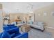 Open concept living room with comfortable seating and views into dining and kitchen areas at 974 Rotonda Cir, Rotonda West, FL 33947