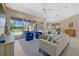 Bright and airy living room with sliding glass doors leading to the pool area at 974 Rotonda Cir, Rotonda West, FL 33947