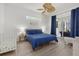 Well-lit main bedroom featuring wood floors and a sliding door to the pool and patio at 974 Rotonda Cir, Rotonda West, FL 33947