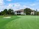 Golf course putting green with building in the background at 12610 Sorrento Way # 204, Bradenton, FL 34211