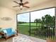 Screened lanai with golf course view and comfy seating at 12610 Sorrento Way # 204, Bradenton, FL 34211