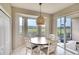 Cozy dining area with a table and chairs, overlooking the golf course at 811 Fairwaycove Ln # 107, Bradenton, FL 34212