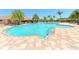 Community pool with surrounding patio and palm trees at 811 Fairwaycove Ln # 107, Bradenton, FL 34212