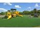 Community playground with playset and soft surface at 811 Fairwaycove Ln # 107, Bradenton, FL 34212