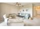 Bright living room featuring a comfy sofa and plenty of natural light at 811 Fairwaycove Ln # 107, Bradenton, FL 34212