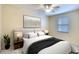Bright bedroom with king-size bed and ceiling fan at 811 Fairwaycove Ln # 107, Bradenton, FL 34212